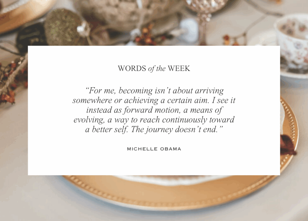 The background image features a place setting at a whimsically decorated table. Text in the middle contains the quote of the week by Michelle Obama: "For me, becoming isn't about arriving somewhere or achieving a certain aim. I see it instead as a forward motion, a means of evolving, a way to reach continuously toward a better self. The journey doesn't end."