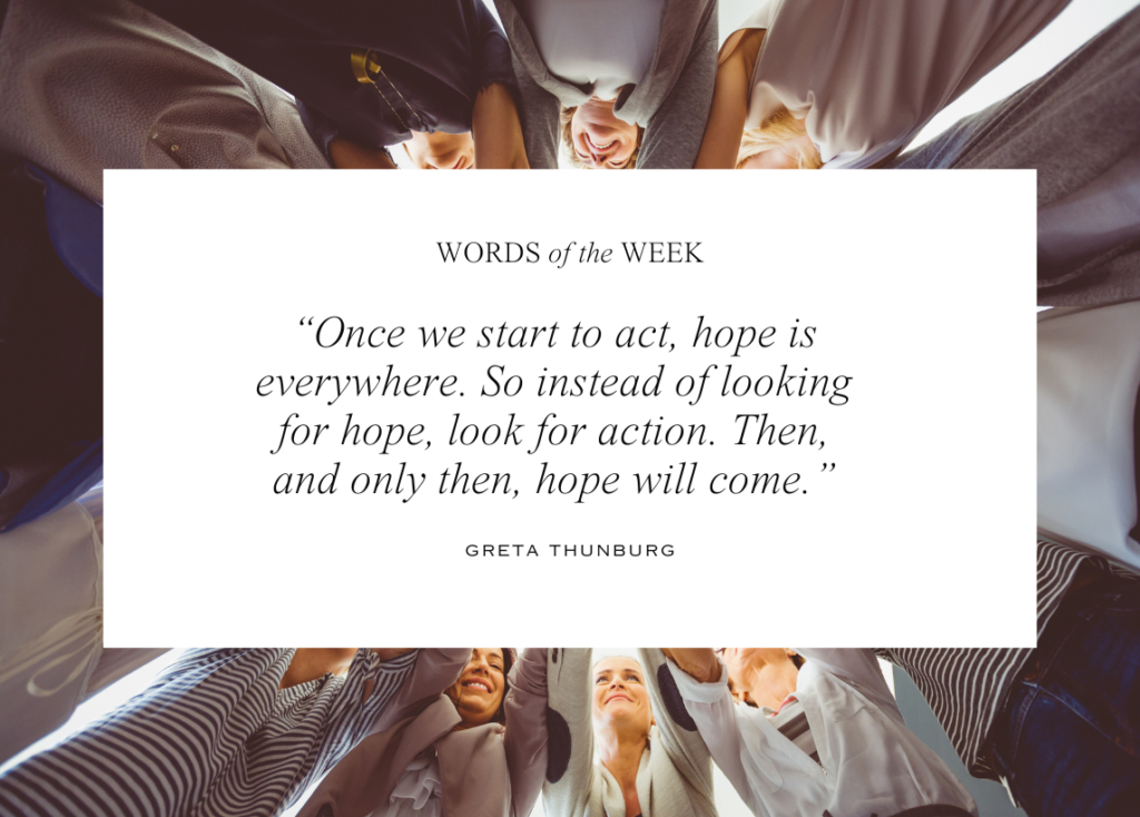 A quote from Greta Thunburg: Once we start to act, hope is everywhere. So instead of looking for hope, look for action. Then, and only then, hope will come. This text is contained within a white box, and the background is an image of a circle of women each holding their hands toward the middle.